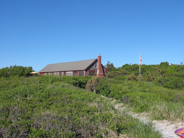 House is nestled into the dune just 50 feet from the stairs to the beach