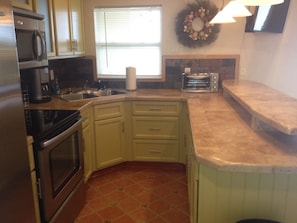 Full size kitchen, Stainless steel appliances.  Coffe maker and toaster oven