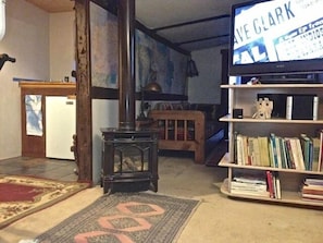 Kitchen, Yodel Gas Stove and TV on the way to the sitting/library area.