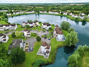 Aerial view looking down at Windrush Turret Lodge - bottom centre. 