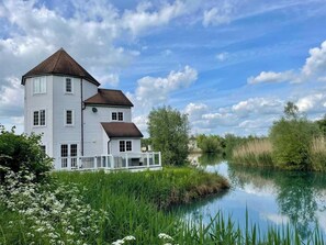 Windrushy Turret Lodge and decking by the lake