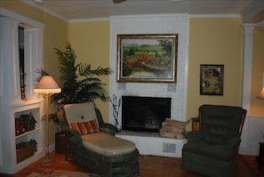  FIREPLACE ROOM WITH VINTAGE CHAISE.
