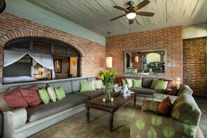 Living Room Area with windows to Room #123 Open in the background