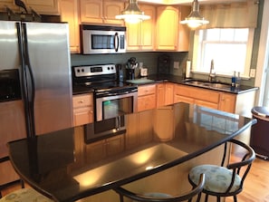 Kitchen with Granite Counter Tops and stainless appliances on 2nd floor.