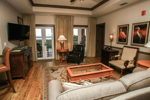 Twin French doors to the Riverfront porch