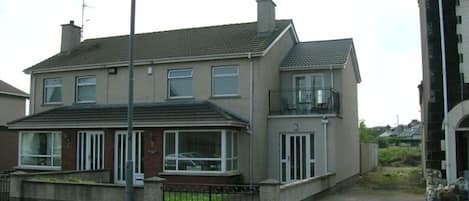 Front view of house. Semi detached, Mullaghard is on the right.