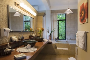 Master bath with large tub and separate shower
