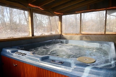 Hot Tub on upper deck. Fully enclosed to use in the winter
