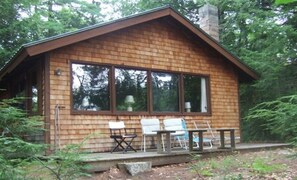 Main house with wrap-around deck, facing east.