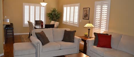 Living room, dining room, vaulted ceilings throughout home