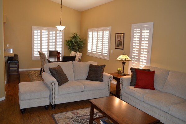 Living room, dining room, vaulted ceilings throughout home