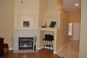 Hallway to front door, turn left to bedrooms, laundry room & garage