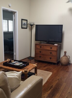 Two TVs with cable includes this flat screen in the living room.
