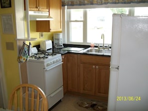 Fabulous NEW oak kitchen with granite countertops.  Stove and refrigerator.