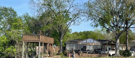 Offering a boat slip, swimming area, Outdoor kitchen, fire table and fireplace 