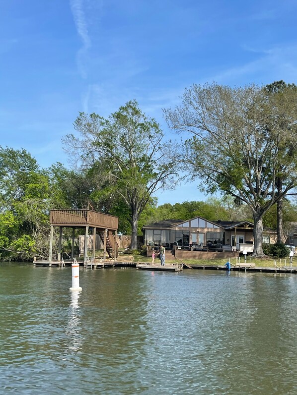 Offering a boat slip, swimming area, Outdoor kitchen, fire table and fireplace 