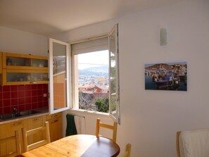 The upstairs kitchen area with view towards the port