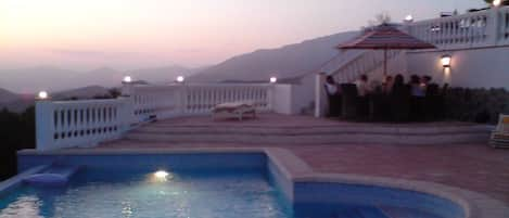 Large pool on private terrace with ocean and mountain views