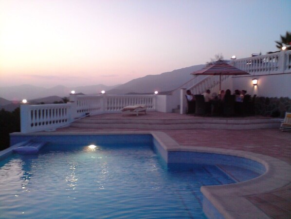 Large pool on private terrace with ocean and mountain views