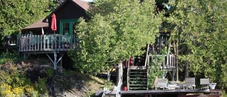 view of main cottage with decks and docks ect.