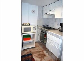 Kitchen - new gas stove and oven, microwave, full size refrigerator.