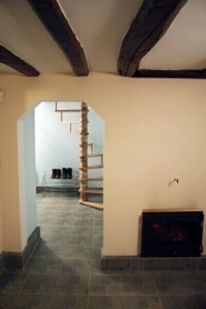 Open plan view and spiral stairs to first floor