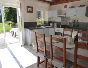 With French doors leading to the sunny patio area