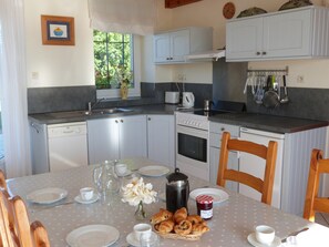 Large sunny kitchen at the heart of the house