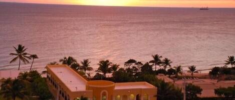 Beautiful sunrise behind the beachfront Cabana Pool house