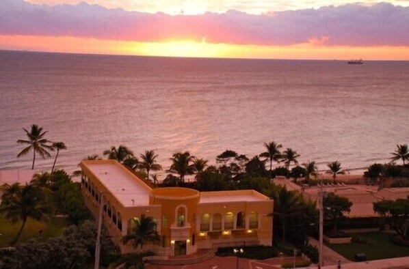 Beautiful sunrise behind the beachfront Cabana Pool house