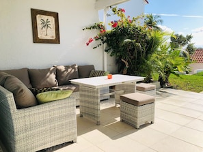 Private back patio-ocean view. Steps from western pool, dock & sundeck & ocean.