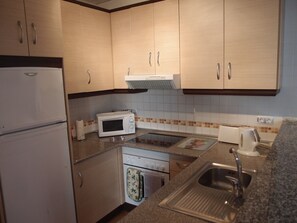 Modern kitchen with oven, hob, microwave and washer/dryer. Everything you need!