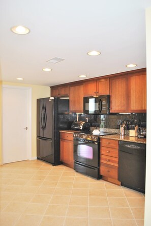 
Kitchen with Quartz Countertops open to dining room.