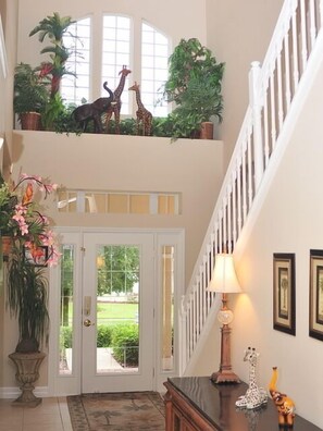 Welcoming Front Entrance With Tropical Feel 