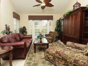 The Spacious Living Room with HDTV, Blu-Ray DVD player, Cable, and Pool View
