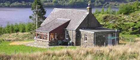 Finchairn Cottage set on a secluded hill side with far reaching views.