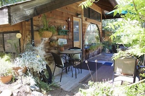 Outdoor deck with seating, table and great mountain view...