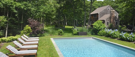 Heated 40'x20' pool gets sun all day and is surrounded by beautiful hydrangeas