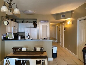 Fully Stocked Kitchen and View of the Entry Way