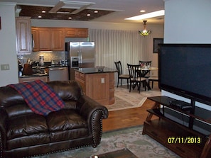 Living room with view of Kitchen and Dining area