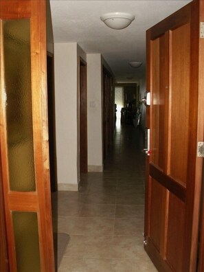 The entranceway and hallway leading into the condo. Digital entrance - NO KEYS!