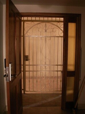 The breezeway gate at our condo entrance welcomes you to our Rose in Winter!