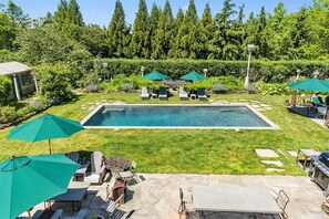 heated salt water gunite pool with lots of seating areas