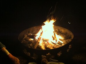 Enjoy S'mores by the fire, under a starry night sky.