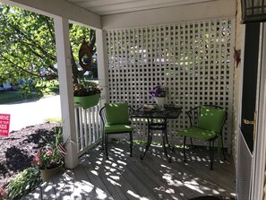 Front porch with seating and eating area.
