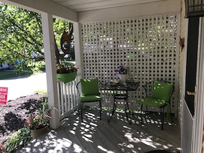 Front porch with seating and eating area.
