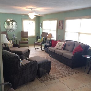 Spacious living room with view of canal and marsh. Life is good!