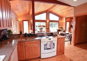 View from kitchen to living room out to deck 