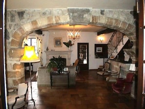 Living Room showing stone arch