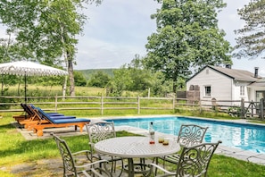 Relax or enjoy food and drinks by the pool
